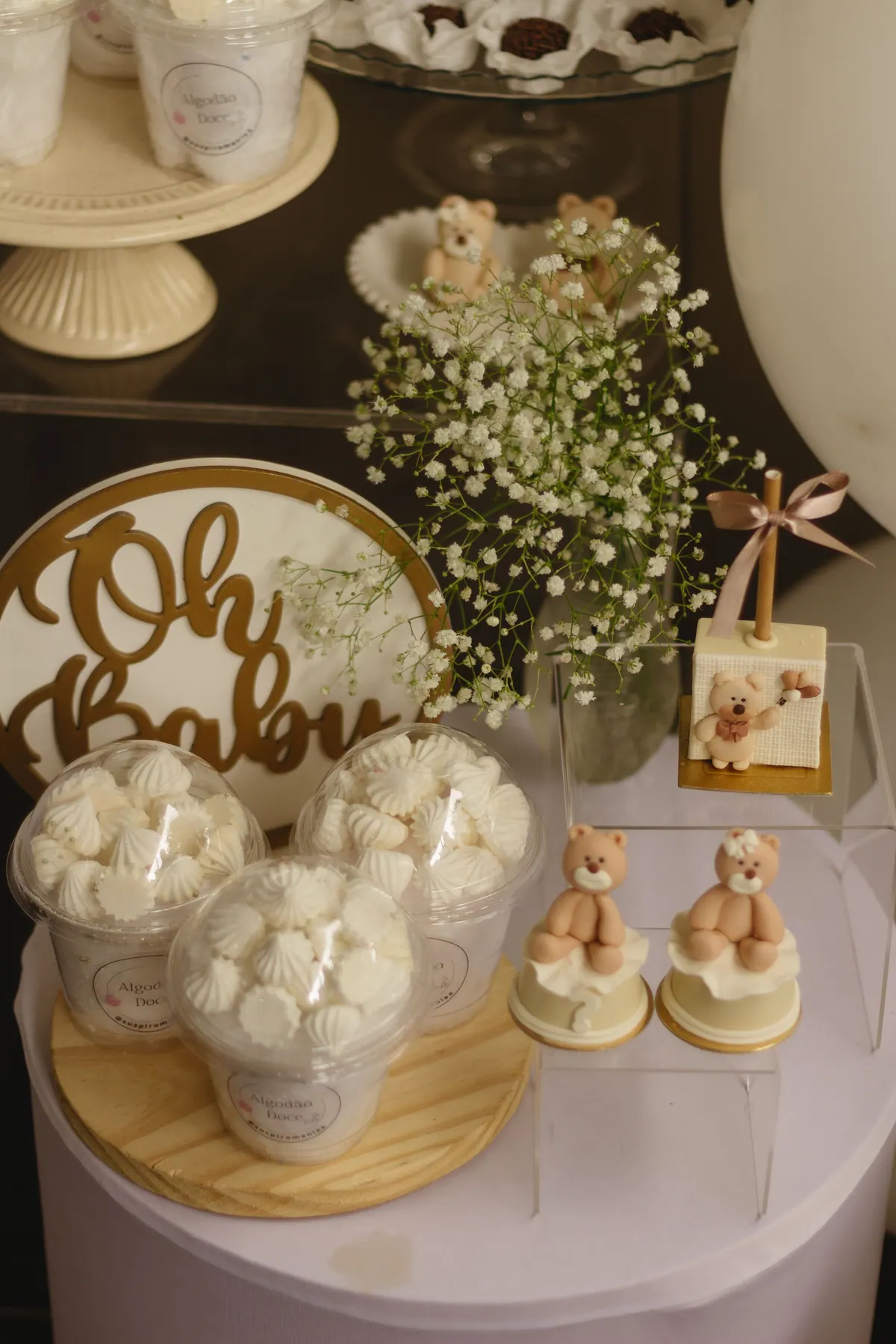 A decorated wedding table with flowers, glassware and place settings.